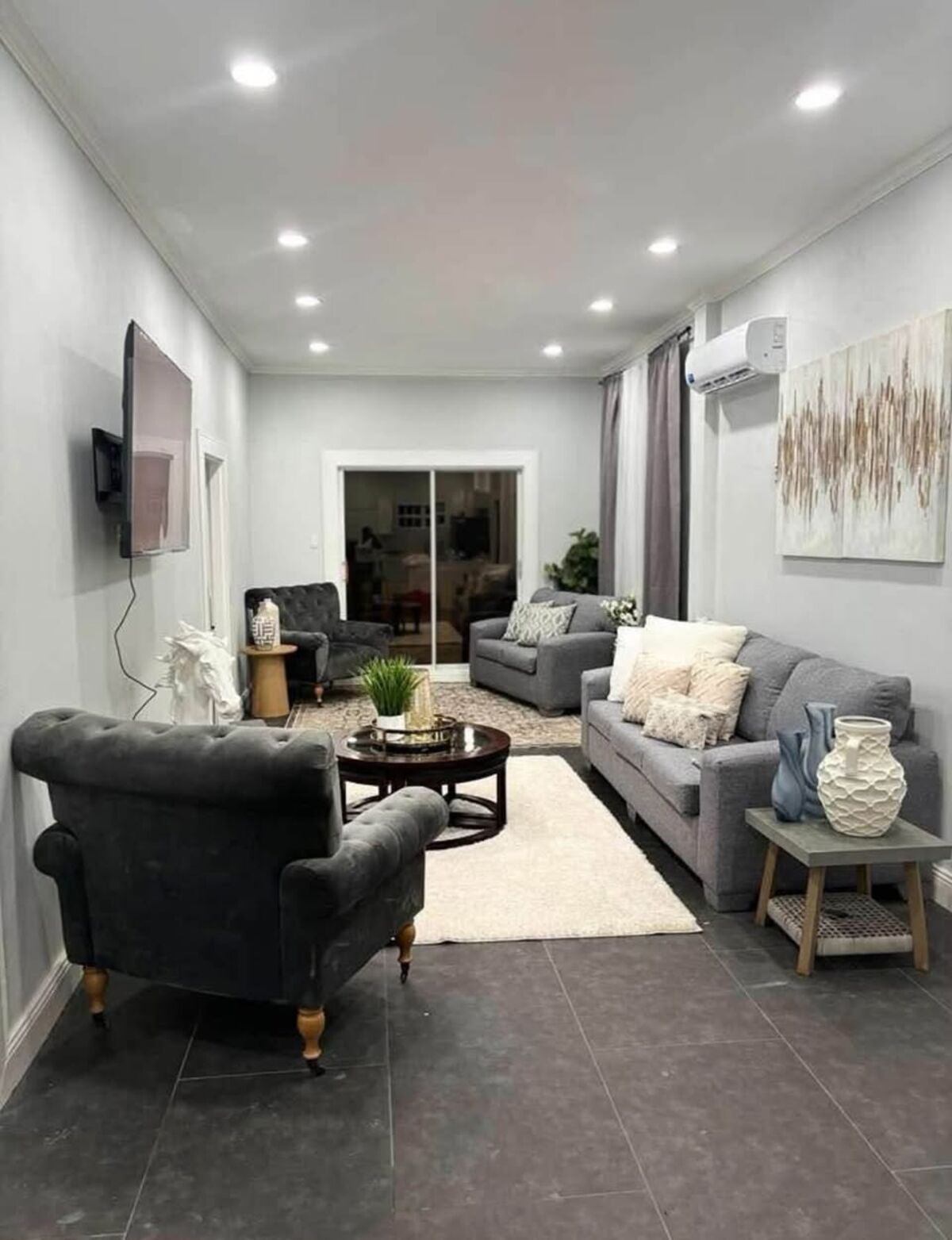 Furnished living room with grey sofas and a rug